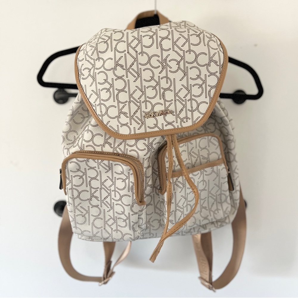 Beautiful cream and tan Calvin Klein brand printed backpack very gently used.